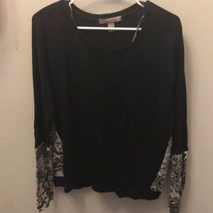 Black crewneck sweater.